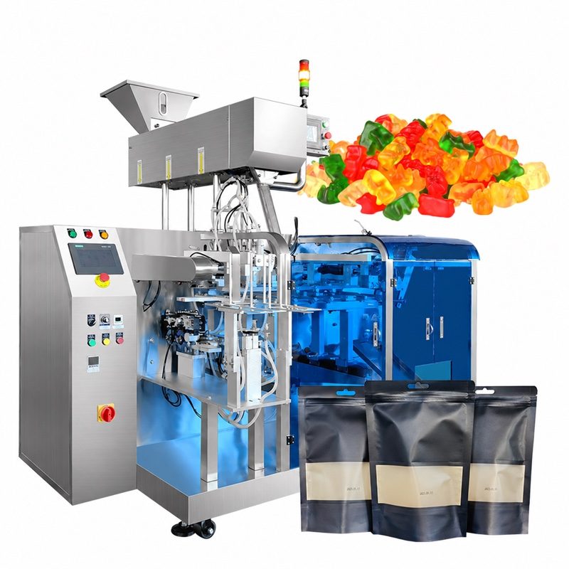Premade pouch machine with a stainless feeder on top, a control cabinet at the left, gummy bears and three black zipper stand-up pouches with windows.